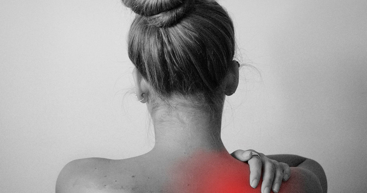 Woman Massaging Her Painful Shoulder
